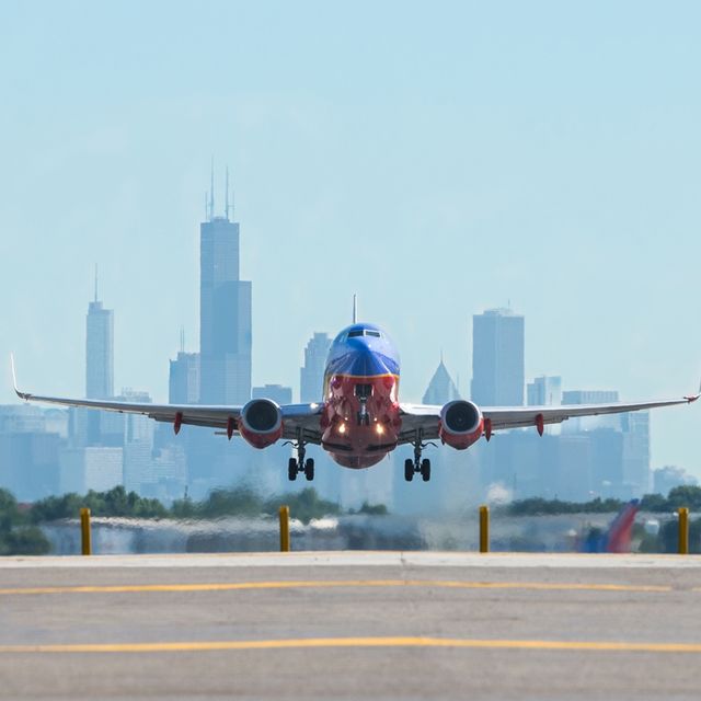 Airplane taking off in front of Chicago skyline